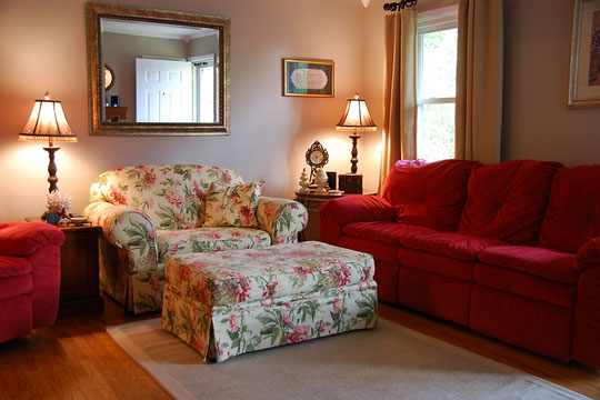 traditional living room couch with oversized chair and ottoman